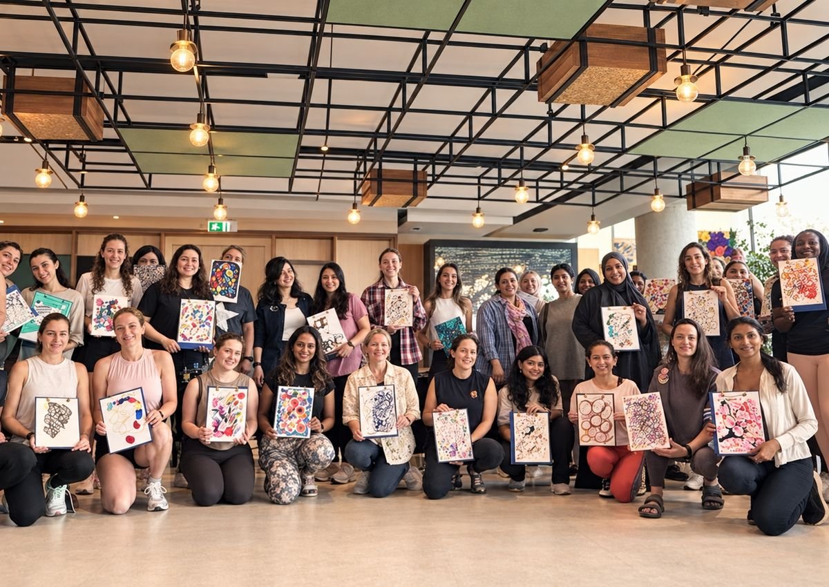 A group holding their artworks