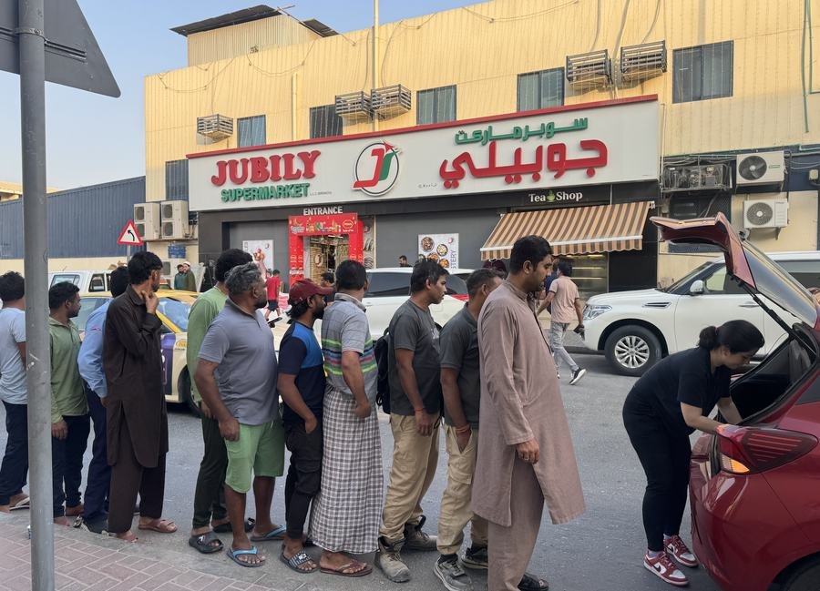 Workers queuing for iftar meals in Dubai